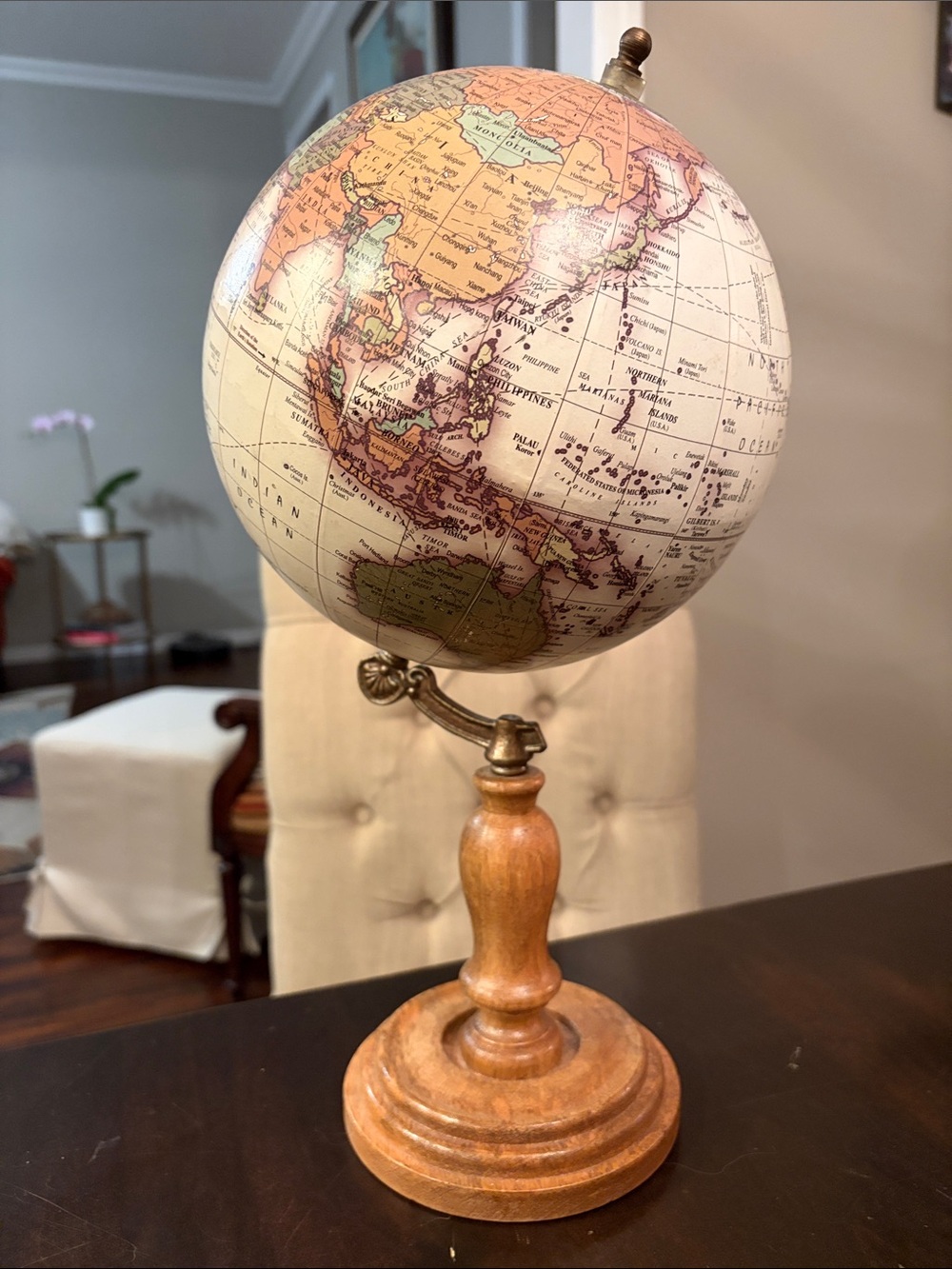 Vintage-Style Beige and Tan Tabletop Globe on Wooden Stand